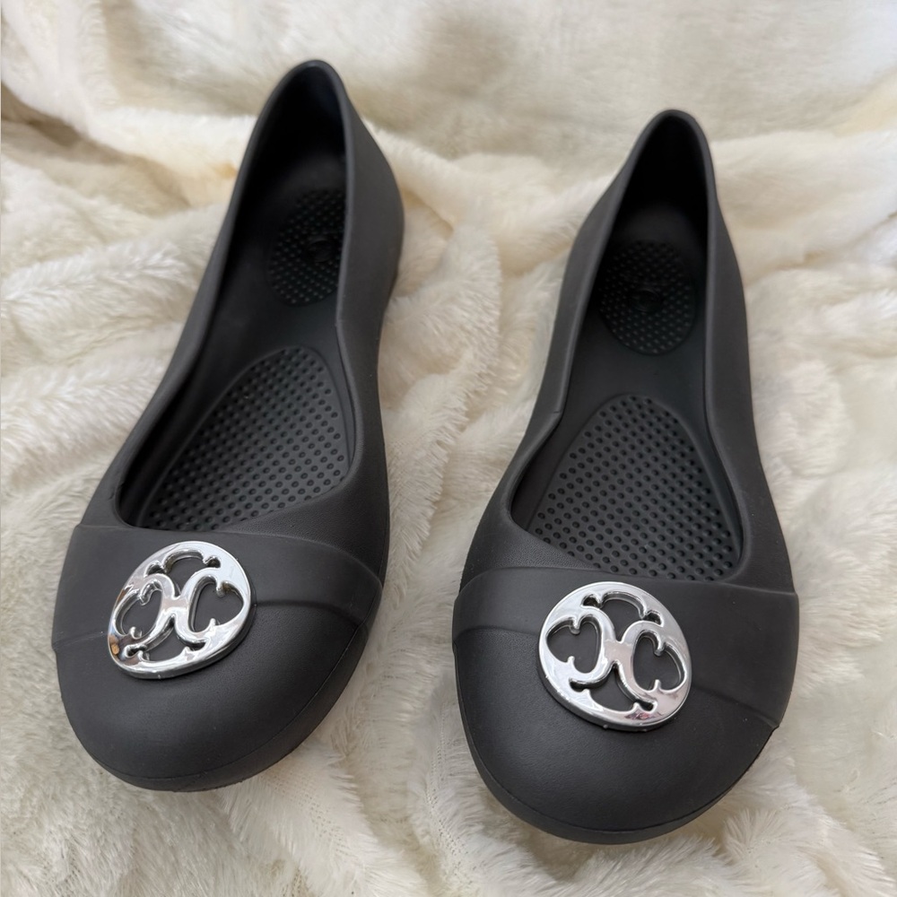 Black Women's Slip-On Ballet Flats with Silver Emblem
